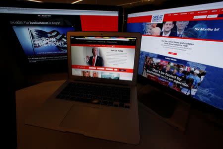 The websites of the three largest Political Action Committee (PAC) groups supporting U.S. President Donald Trump and his agenda, including (L-R) the sites of "America First Policies", "Committee to Defend the President" and "Great America PAC" are seen on computer screens in this photo illustration taken in Washington, U.S. June 27, 2017. REUTERS/Jim Bourg/Illustration