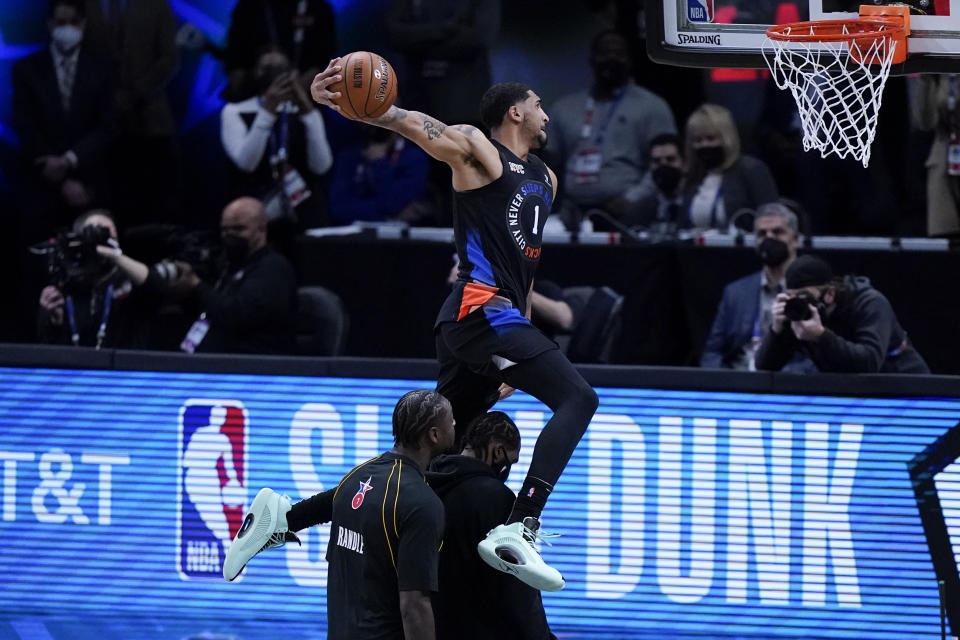 New York Knicks' Obi Toppin competes in the Slam Dunk contest during basketball's NBA All-Star Game in Atlanta, Sunday, March 7, 2021. (AP Photo/Brynn Anderson)