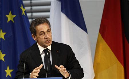 Former French President Nicolas Sarkozy gesture during his speech at an event hosted by the Konrad-Adenauer foundation in Berlin February 28, 2014. REUTERS/Tobias Schwarz