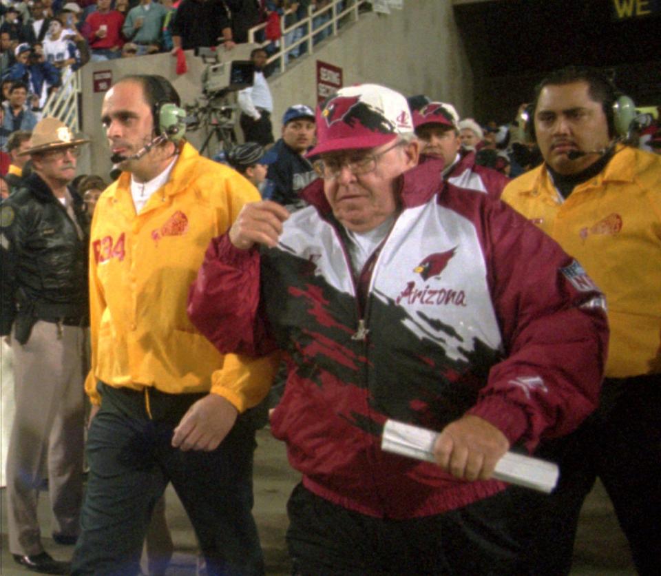 Cardinals coach Buddy Ryan walks onto the field before a Christmas Day game in 1995 against the Cowboys at Sun Devil Stadium.