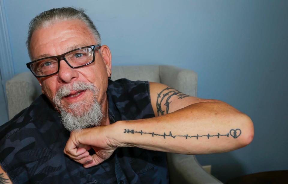 John Bock, of Manitowoc, shows his heart beat tattoo, Friday, July 14, 2023, in Manitowoc, Wis.