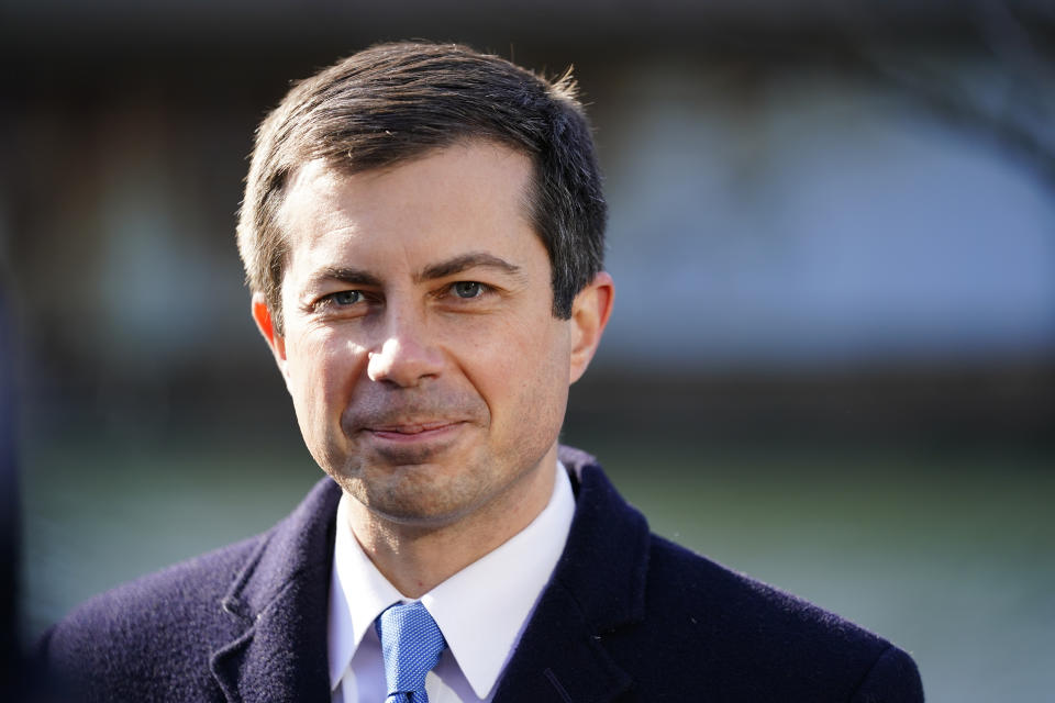 FILE - Transportation Secretary Pete Buttigieg listens at an event in Philadelphia, on Jan. 14, 2022. Buttigieg is vowing help to stem a rising U.S. epidemic of car fatalities with a broad-based government strategy aimed at limiting the speed of cars, redesigning roads to better protect bicyclists and pedestrians and boosting car safety features such as automatic emergency braking. Buttigieg indicated to The Associated Press that new federal data being released next week will show another spike in traffic fatalities through the third quarter of 2021. (AP Photo/Matt Rourke, File)