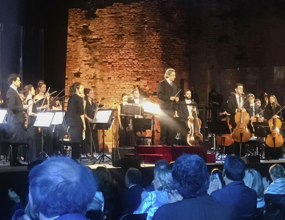 Italian Maestro Riccardo Muti, top center, prepares to direct a concert at the Ravenna Festival, in Ravenna, Northern Italy, Sunday, June 21, 2020. Riccardo Muti has sent a resounding message that live classical music has returned the Italian stage after the coronavirus lockdown with a full summer festival program in his adopted Ravenna. (AP Photo/Colleen Barry)
