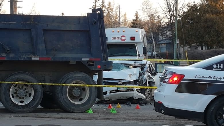 2 people in stable condition after car hits dump truck in Winnipeg