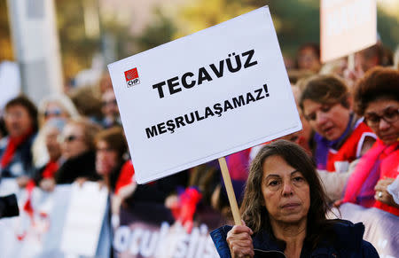 A protester holds a banner reading, "rape can not be legitimized" during a protest against a proposal that would have allowed sentencing in cases of sexual abuse committed "without force, threat or trick" before Nov. 16, 2016 to be indefinitely postponed if the perpetrator marries the victim, in front of the Turkish Parlaiment in Ankara, Turkey, November 22, 2016. REUTERS/Umit Bektas