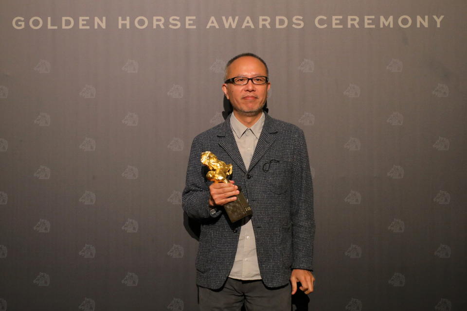 Director and writer Chung Mong-hong of &#x00201c;The Falls&#x00201d; poses with his Best Original Screenplay award at the 58th Golden Horse Awards in Taipei, Taiwan November 27, 2021. REUTERS/Annabelle Chih