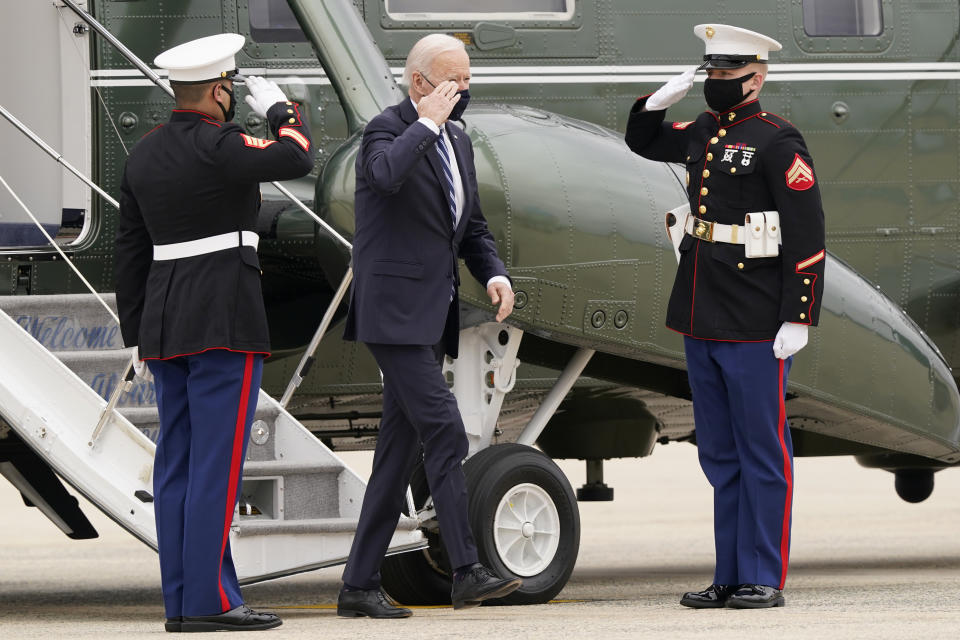 President Joe Biden salutes as he walks off of Marine One and heads towards Air Force One at Andrews Air Force Base, Md., Tuesday, March 16, 2021, to depart for a trip to Pennsylvania. (AP Photo/Susan Walsh)