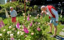 Marmier and Bugnon walk in their garden in Lausanne