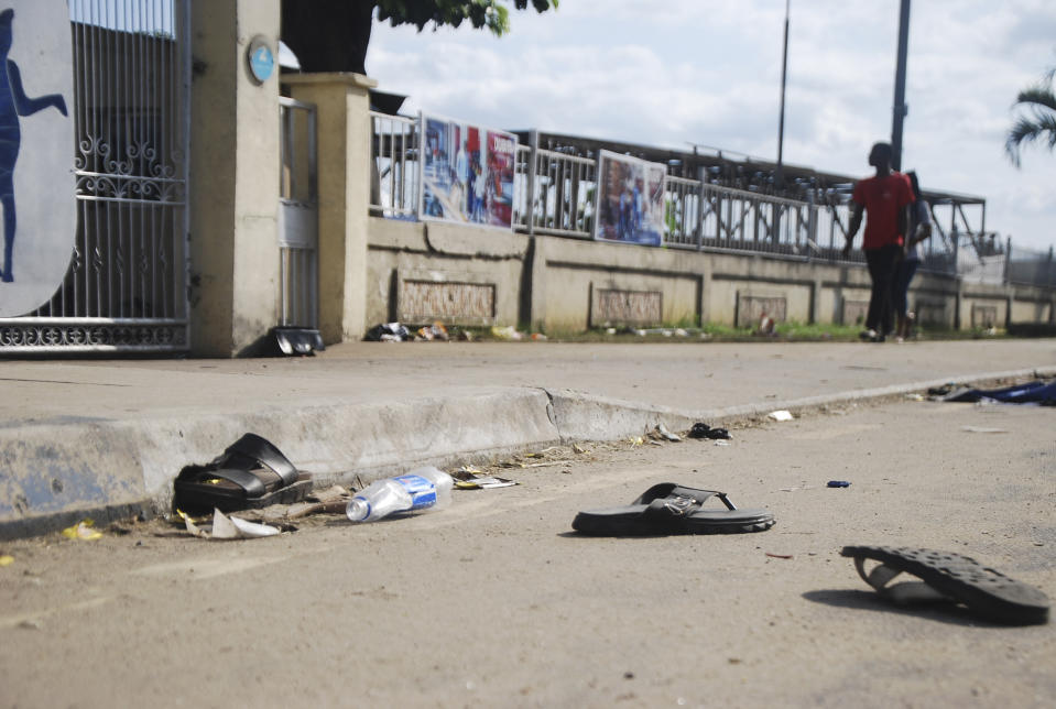 A view of flip fops and sandals on the street, following a stampede in Port Harcourt, Nigeria, Saturday, May 28, 2022. Police say a stampede at a church charity event in southern Nigeria has left at least 31 people dead and seven injured. One witness said the dead included a pregnant woman and “many children.” Police said the stampede took place at an annual “Shop for Free” program organized by the Kings Assembly Pentecostal church in Rivers state. Such events are common in Nigeria, (AP Photo)