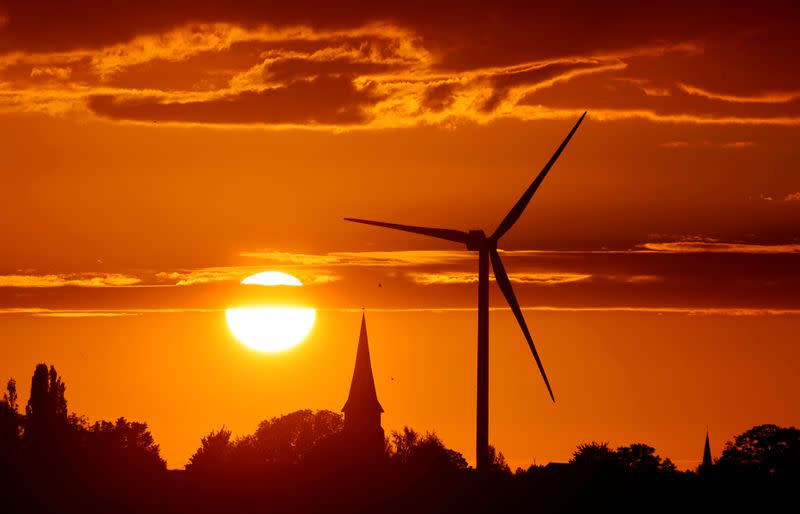 FILE PHOTO: FILE PHOTO: A power-generating windmill turbine is pictured during sunset at a renewable energy park in Ecoust-Saint-Mein, France