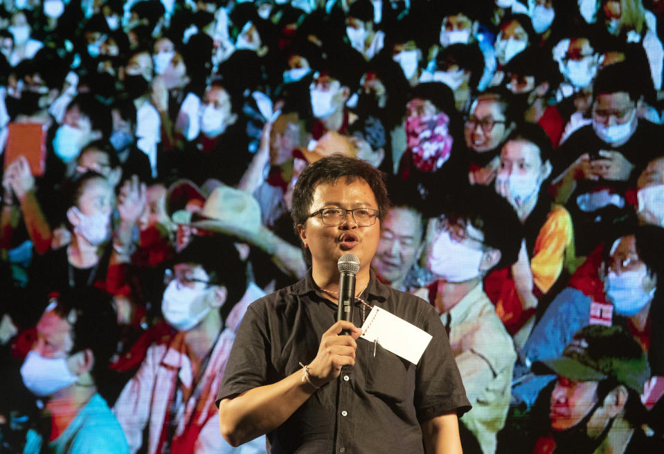 Pro-democracy activist and human rights lawyer Arnon Nampha talks to pro-democracy students during a protest at Thammasat University in Pathum Thani, north of Bangkok, Thailand, Monday, Aug, 10, 2020. Protesters warned that they'll step up pressure on the government if it failed to meet their demands, which include dissolving the parliament, holding new elections and changing the constitution. (AP Photo/Sakchai Lalit)