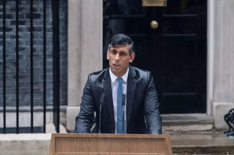 Prime Minister Rishi Sunak makes a statement as raining outside 10 Downing Street announcing UK general election will take place on 4 July in London, United Kingdom