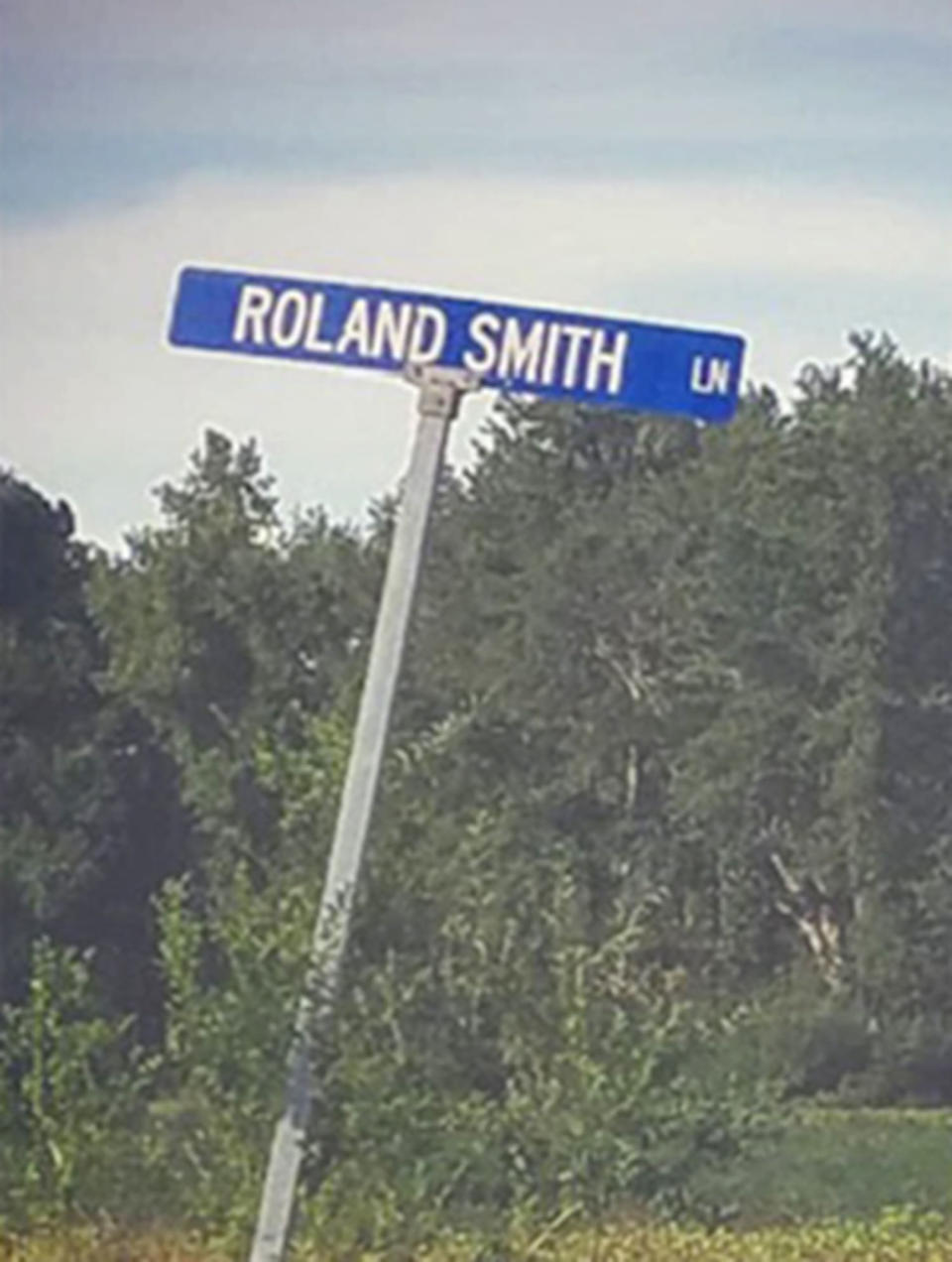 A street sign reads Roland Smith Lane. (Courtesy Evelyn Booker)