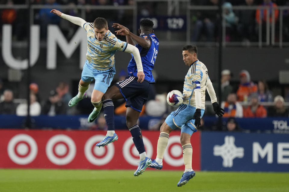 From left to right, Philadelphia Union forward Mikael Uhre, FC Cincinnati defender Yerson Mosquera, and Union midfielder Alejandro Bedoya, go up for the ball during the first half of an MLS Eastern Conference semifinals playoff soccer match, Saturday, Nov. 25, 2023, in Cincinnati. (AP Photo/Carolyn Kaster)