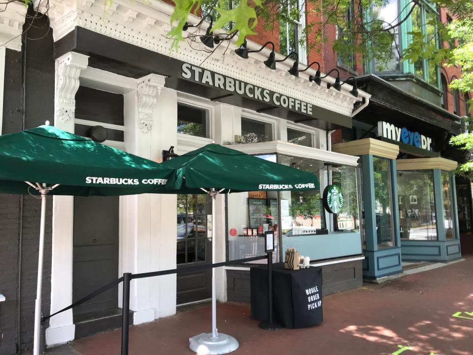 A Starbucks in southeast Washington, D.C. where customers can pick up drinks outside. Tape marks off where to stand so people are properly distanced. (Photo: Arthur Delaney)