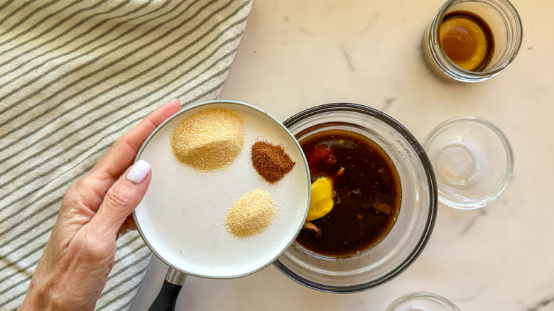 adding spices to bowl