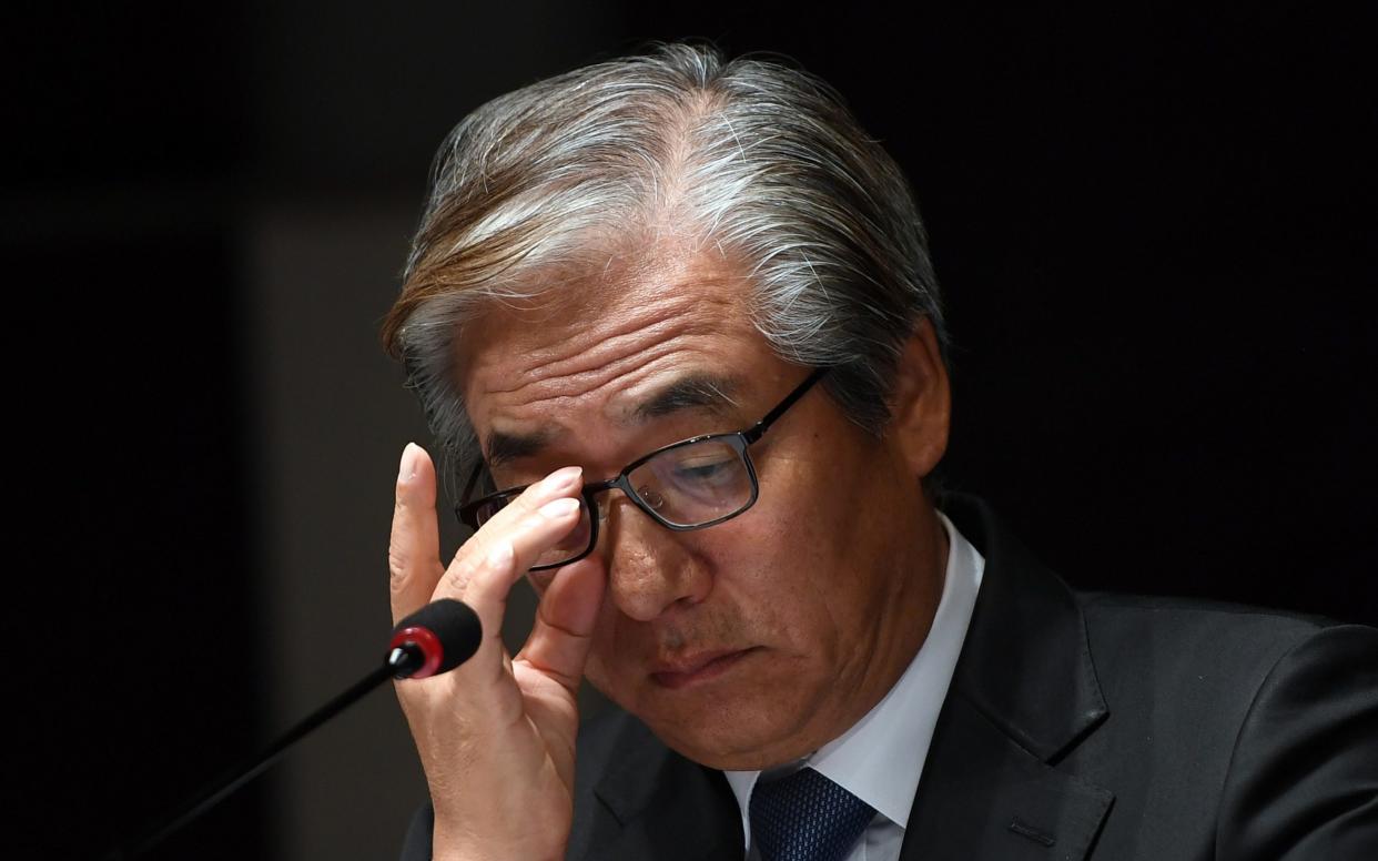 Kim Hyo-joon, head of the BMW's Korea unit, during a press conference at a hotel in Seoul on August 6, 2018 - AFP