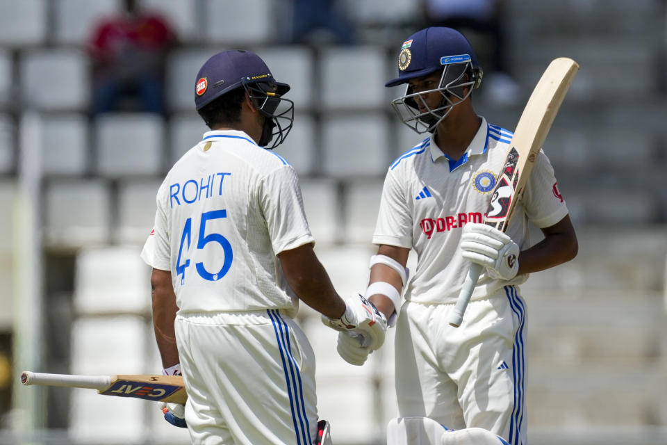 India's captain Rohit Sharma congratulates Yashasvi Jaiswal for scoring half a century against West Indies on day two of their first cricket Test match at Windsor Park in Roseau, Dominica, Thursday, July 13, 2023. (AP Photo/Ricardo Mazalan)