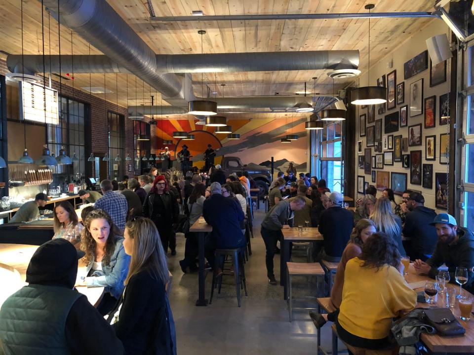 At Level Crossing Brewing in South Salt Lake City, Utah, local musicians play on a 1946 Chevy flatbed truck converted into a stage. A mural behind it was painted by Jann Haworth, who helped design the cover of The Beatles’ 'Sgt. Pepper's Lonely Hearts Club Band' album.