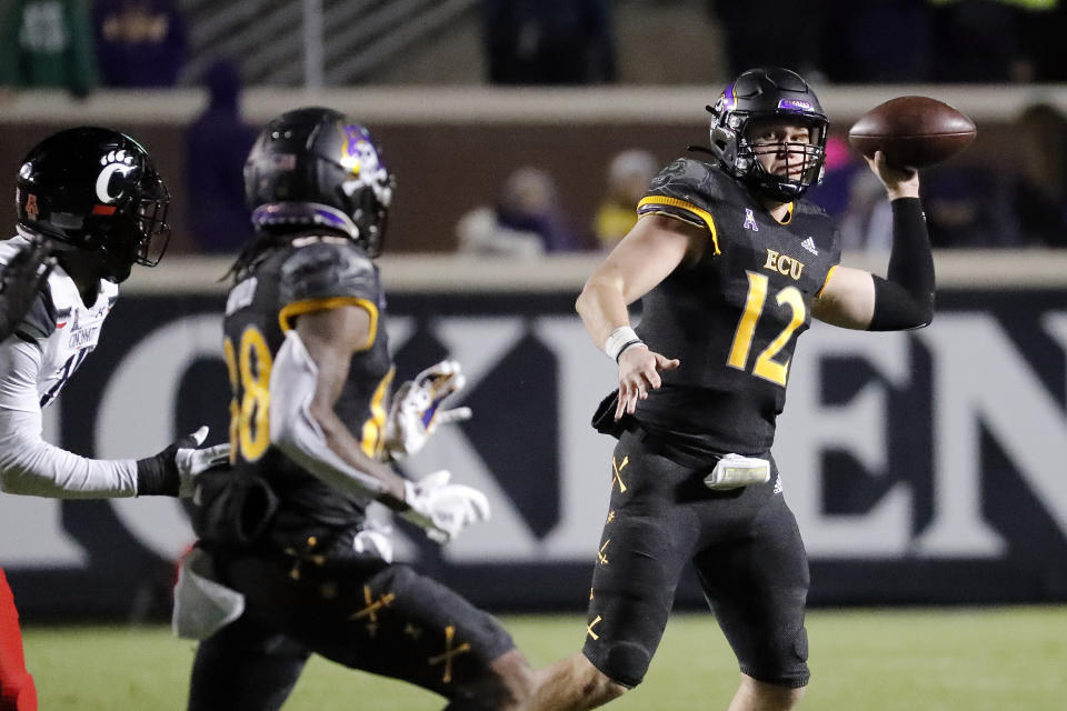 FILE - East Carolina's Holton Ahlers (12) passes the ball to Jsi Hatfield (88) during the second half of an NCAA college football game against Cincinnati in Greenville, N.C., Friday, Nov. 26, 2021. East Carolina will host No. 13 North Carolina State on Saturday to open the season. (AP Photo/Karl B DeBlaker)