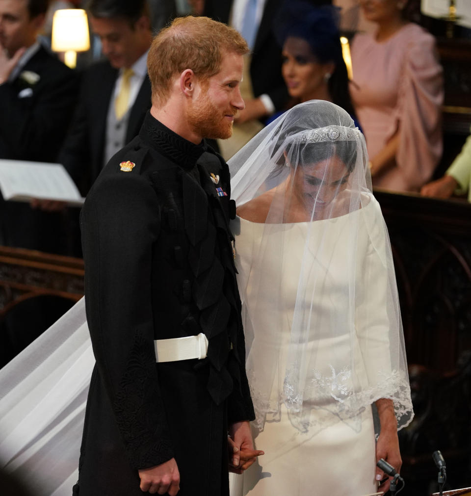 Prince Harry and Meghan Markle stand together in St George’s Chapel at Windsor Castle for their wedding (Getty)