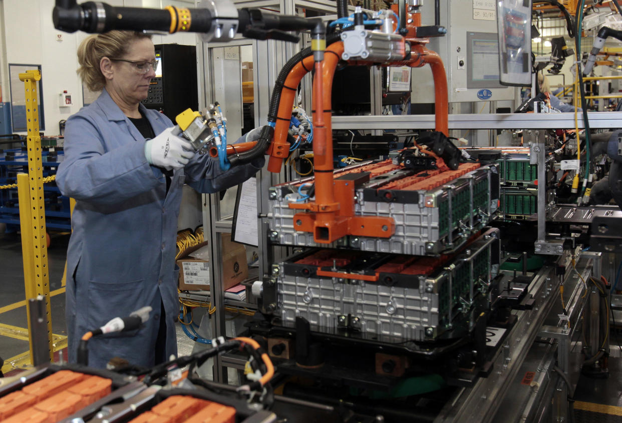 A Ford Motor production worker assembles batteries for Ford electric and hybrid vehicles at the Ford Rawsonville Assembly Plant in Ypsilanti Twsp, Michigan November 7, 2012. Ford Motor Co marked on Thursday the production launch of its latest plug-in hybrid at a former SUV factory that now serves as a model for the second-largest U.S. automaker's global manufacturing strategy. REUTERS/Rebecca Cook  (UNITED STATES - Tags: TRANSPORT BUSINESS)