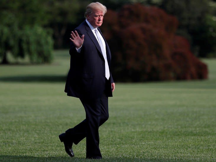 FILE PHOTO: U.S. President Donald Trump waves to the news media after returning on Marine One after visiting first lady Melania Trump at Walter Reed National Military Medical Center from the South Lawn of the White House in Washington, U.S., May 15, 2018. REUTERS/Leah Millis