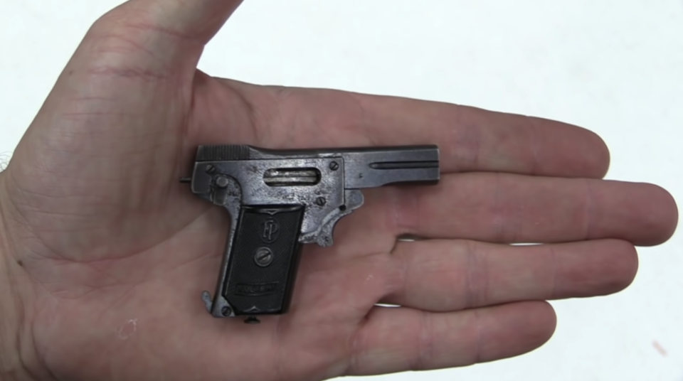 A pistol fitting in the palm of a hand