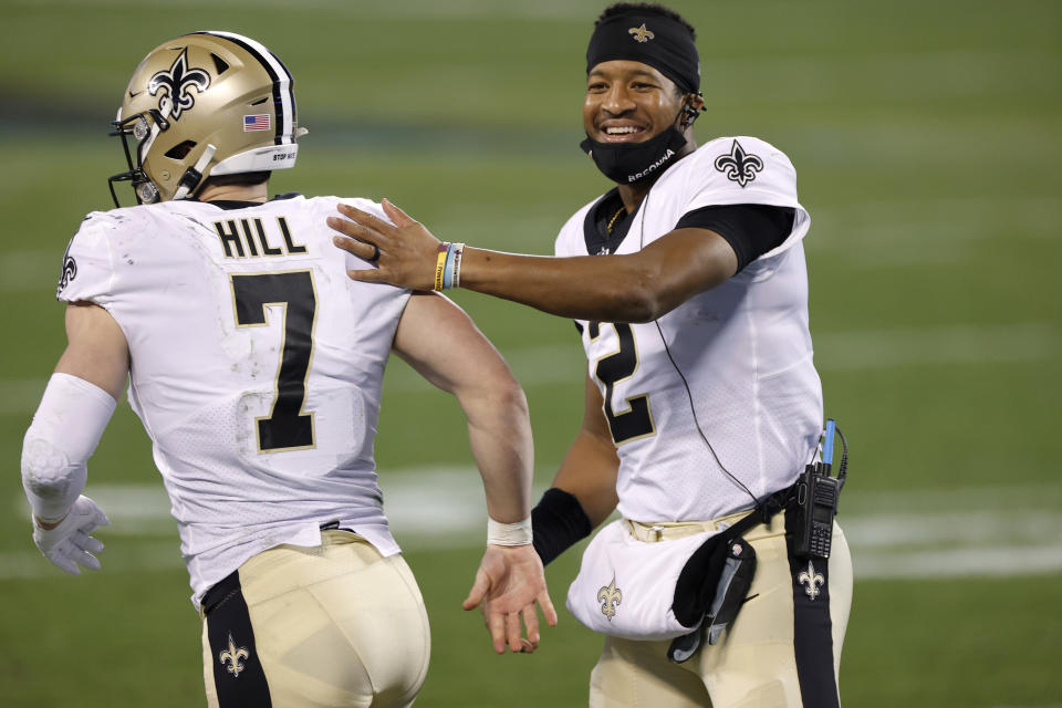 Jameis Winston (2) and Taysom Hill (7) will compete for the Saints' starting quarterback job. (Photo by Jared C. Tilton/Getty Images)