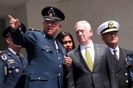 U.S. Defense Secretary James Mattis speaks with Mexico's Defense Minister, General Salvador Cienfuegos, during a welcome ceremony at Plaza de la Lealtad square in the Secretary of National Defense headquarters in Mexico City, Mexico September 15, 2017. REUTERS/Edgard Garrido