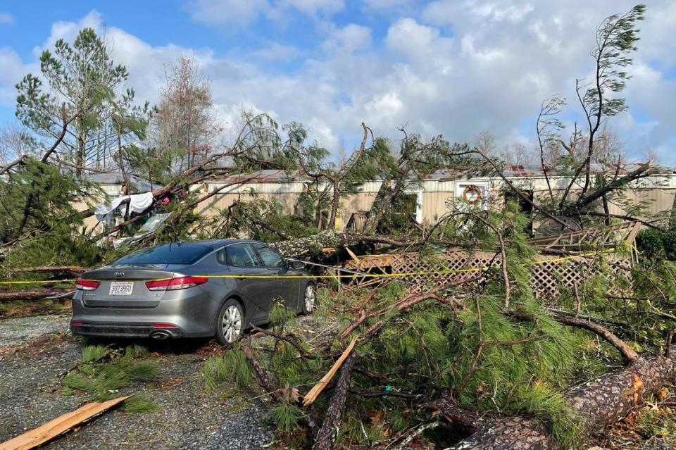 A damaged mobile home where two people died is seen, in Flatwood, Ala. on Wednesday, Nov. 30, 2022. Tornadoes damaged numerous homes, destroyed a fire station, briefly trapped people in a grocery store and ripped the roof off an apartment complex in Mississippi and Alabama. (AP Photo/Butch Dill)