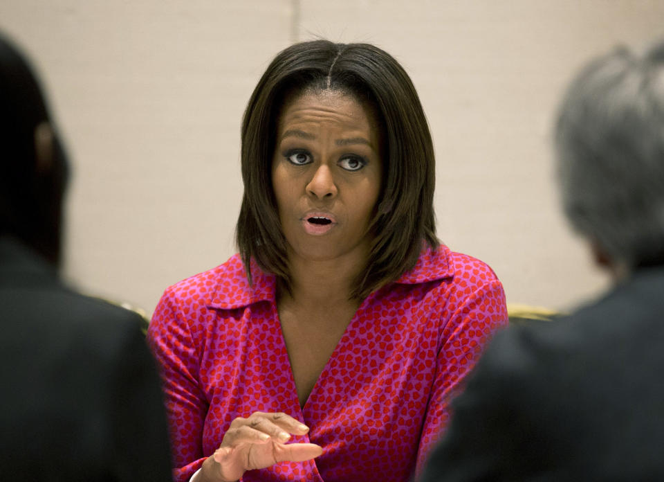 U.S. first lady Michelle Obama speaks during a round table discussion on education at the U.S. Embassy in Beijing, China Sunday, March 23, 2014. (AP Photo/Andy Wong)