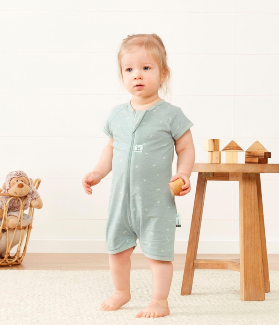 Toddler wearing the ergoPouch Layers Short Sleeve 0.2 TOG fromThe Iconic
