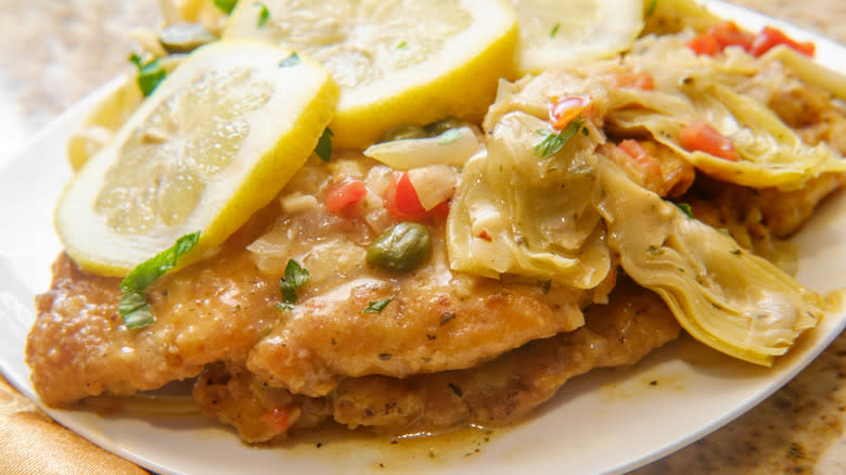 Fried chicken with artichokes and lemons