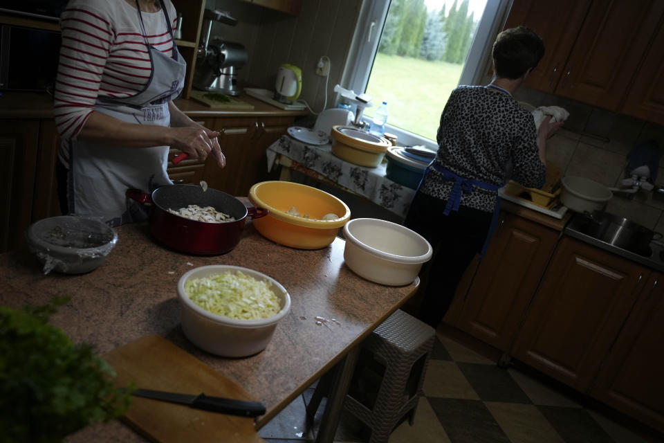 Members of a Muslim congregation cook soup for migrants at the Polish-Belarusian border in Bohoniki near Sokolka, Poland, Saturday, Nov. 13, 2021. (AP Photo/Matthias Schrader)