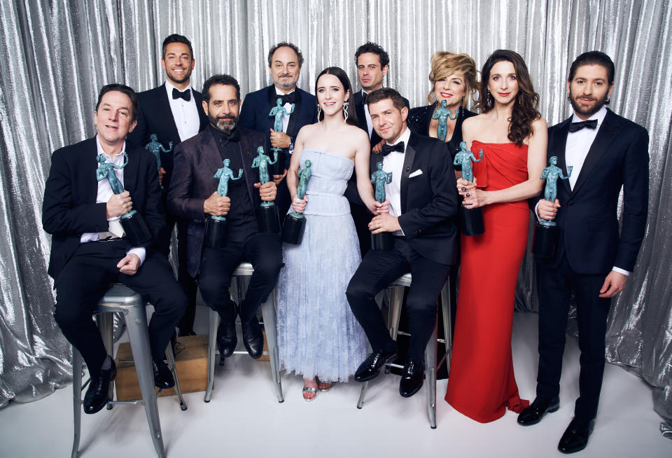 A photo of Joel Johnstone, Caroline Aaron, Michael Zegen, Marin Hinkle, Kevin Pollak, Rachel Brosnahan, Luke Kirby, Brian Tarantina, Tony Shalhoub, and Zachary Levi, winner of Outstanding Performance by an Ensemble in a Comedy Series for 'The Marvelous Mrs. Maisel,' pose in the Winner's Gallery during the 25th Annual Screen Actors Guild Awards at The Shrine Auditorium on January 27, 2019 in Los Angeles, California.