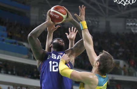 Demarcus Cousins (USA) of the USA and David Andersen (AUS) of Australia compete. REUTERS/Jim Young