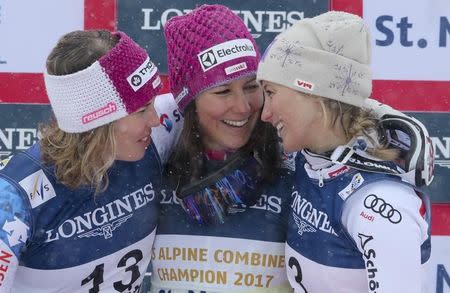 Alpine Skiing - FIS Alpine Skiing World Championships - Women's Alpine Combined - St. Moritz, Switzerland - 10/2/17 - Wendy Holdener of Switzerland is flanked by silver medalist Michelle Gisin of Switzerland (L) and Austria's bronze medal winner Michaela Kirchgasser of Austria after winning the gold medal in the Alpine Combined. REUTERS/Stefano Rellandini - RTX30GCL