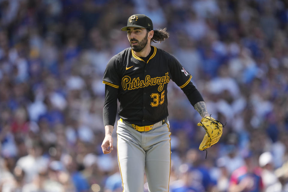 Pittsburgh Pirates pitcher Colin Holderman reacts after striking out Chicago Cubs' Patrick Wisdom with the bases loaded iin the eighth inning of a baseball game Saturday, May 18, 2024, in Chicago. (AP Photo/Charles Rex Arbogast)
