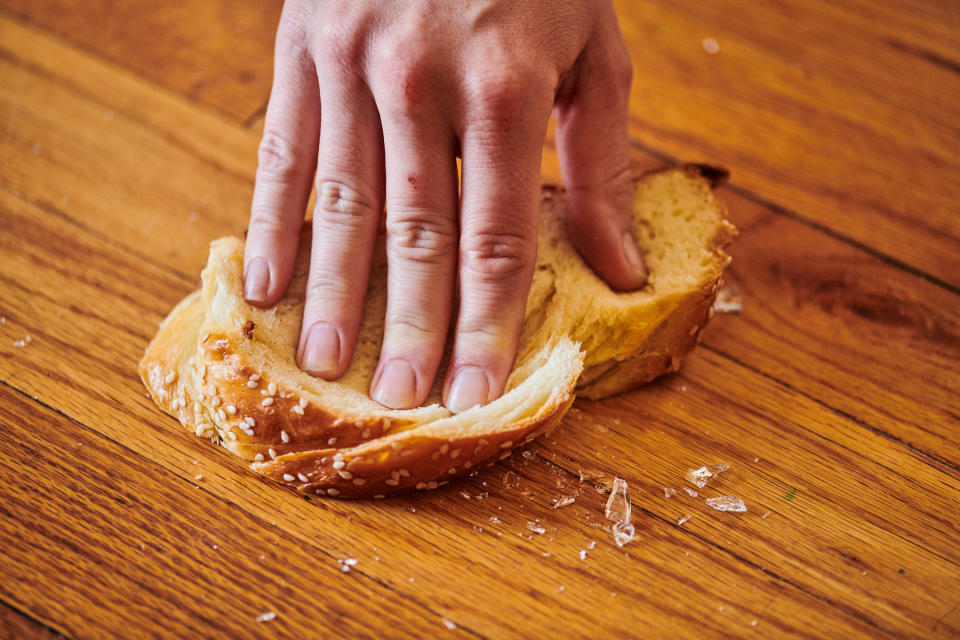 Picking up broken glass with bread