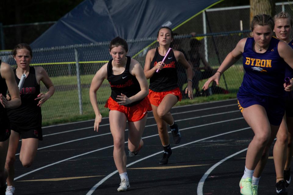 The Jonesville girls 4x100-meter team members Kamdyn Todd and Jalynn Bragg in the final stretch of the race