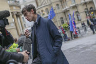 British Conservative Party leadership contender Rory Stewart talks to the media as he arrives for a live TV debate in central London Tuesday, June 18, 2019. Britain's Conservative Party will continue to hold elimination votes until the final two contenders will be put to a vote of party members nationwide, with the winner due to replace Prime Minister Theresa May as party leader and prime minister.(AP Photo/Vudi Xhymshiti)