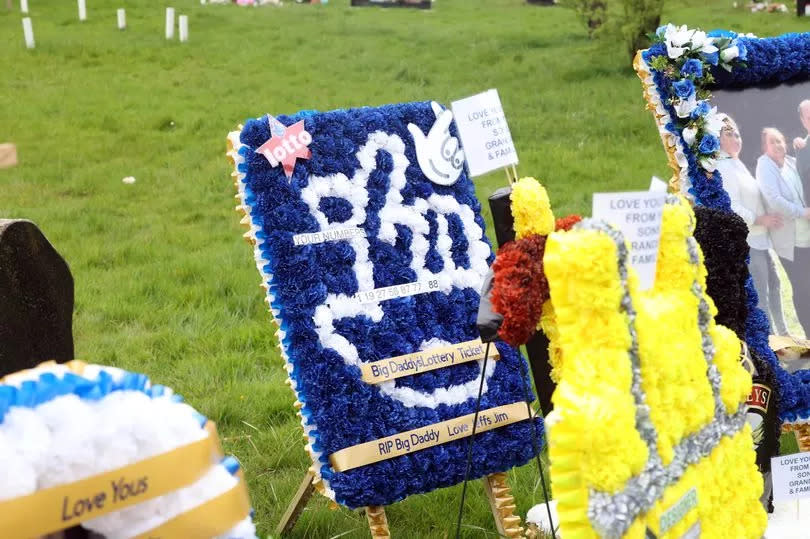 A huge number of floral tributes, including Jim's lucky lotto numbers, were on display