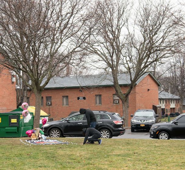 PHOTO: Mourners gather at a makeshift memorial near the intersection of Martin Luther King East and Oakwood Avenue, where 11-year-old Brexialee Torres was killed in a drive-by shooting the night before, in Syracuse, N.Y., Jan. 17, 2023. (Ben Cleeton/The New York Times via Redux)