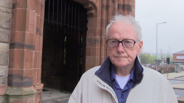 Local resident John McGonagle signed the book of condolence (Michael McHugh/PA)