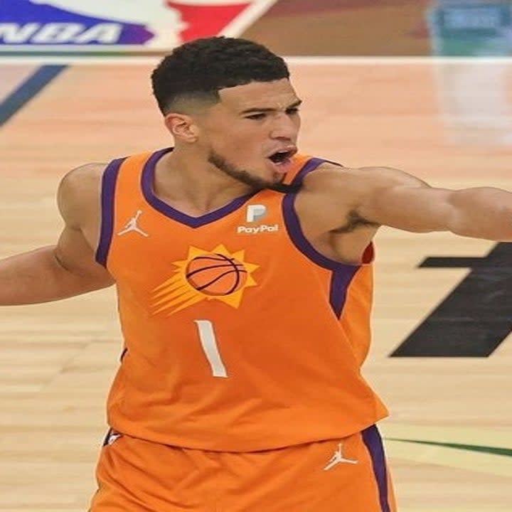 Devin Booker #1 of the Phoenix Suns directs his team against the Milwaukee Bucks