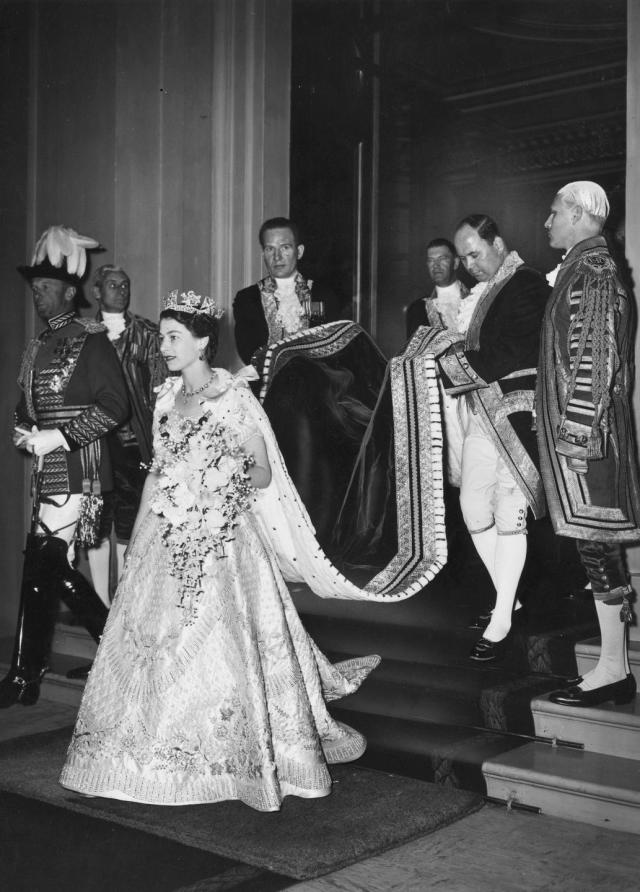 queen elizabeth ii carrying her coronation bouquet, which was made up of white flowers