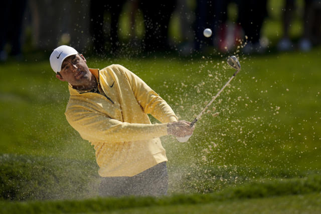 Scottie Scheffler hits from the bunker on the 11th hole during the first round of the PGA Championship golf tournament at Oak Hill Country Club on Thursday, May 18, 2023, in Pittsford, N.Y. (AP Photo/Seth Wenig)