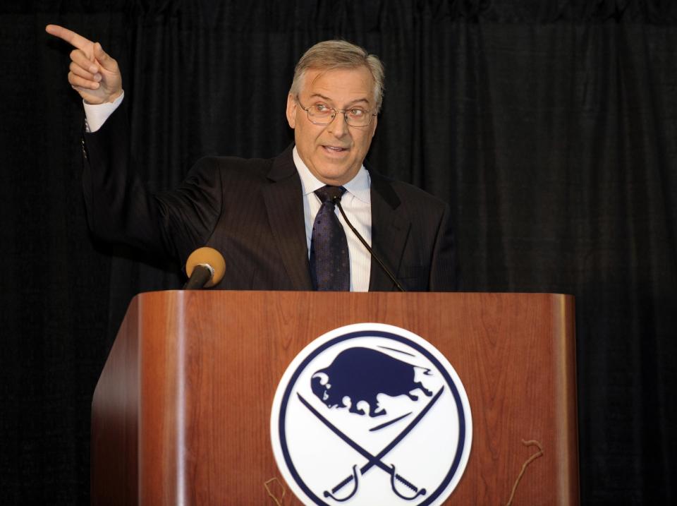 Buffalo Sabres&#39; owner Terry Pegula, gestures toward the First Niagara Center and explains development plans during groundbreaking ceremonies before an NHL hockey game against the Philadelphia Flyers in Buffalo, N.Y., Saturday, April 13, 2013. (AP Photo/Gary Wiepert)