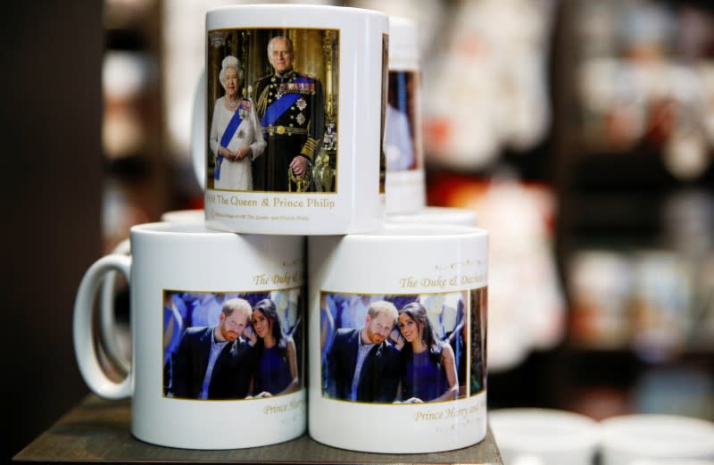 Merchandise depicting Britain's Prince Harry and Meghan, Duchess of Sussex, are seen on display in a souvenir shop near Buckingham Palace in London